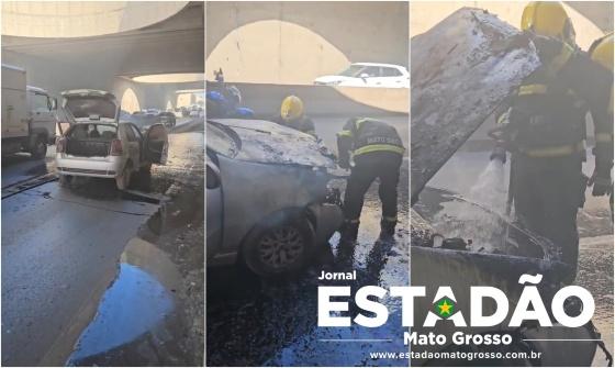 Fogo consumiu veículo na trincheira da Miguel Sutil na manhã desta quarta-feira (18); bombeiros controlaram as chamas